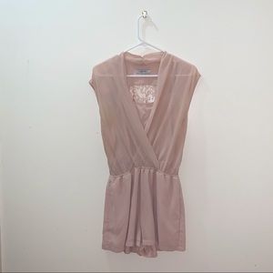 Pink sleeveless lace romper.